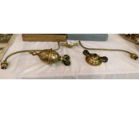 A brass rise and fall ceiling light with Art Nouveau decoration, in need of rewiring