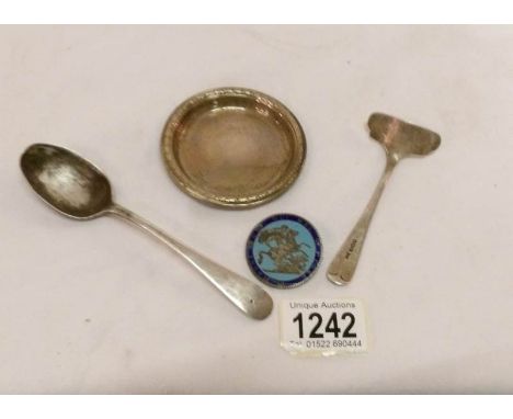 A small silver pin tray, silver spoon, silver pusher and an enamel badge