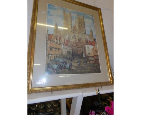 A large gilt framed print of Lincoln Cathedral