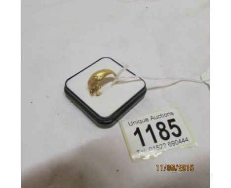 A gold 'Dolphin' ring with ruby eyes and diamond set fin, size M