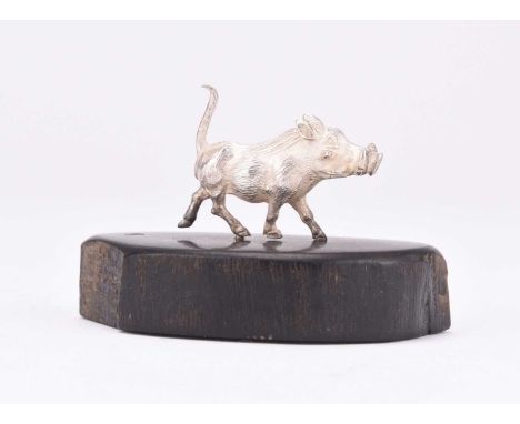 A Patrick Mavros silver model of a Warthog, presented upon wood base, 4.3cm high