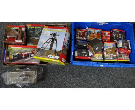 Two boxes comprising mainly Hornby SKaledale buildings and similar rolling stock to include: mining headstock two, country fi