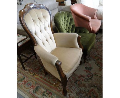 Victorian style button back fireside armchair together with an early 20th century  button back nursing chair and another upho
