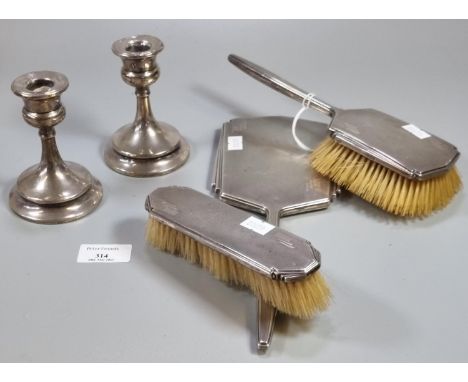 Pair of early 20th century silver dwarf candlesticks with loaded bases together with a silver Art Deco engine turned three pi