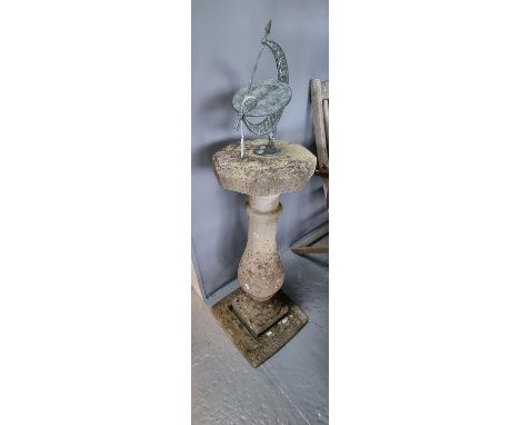 Reconstituted stone baluster shaped pedestal sundial with white metal mount.   (B.P. 21% + VAT) 