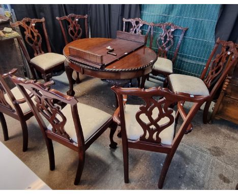 Mid century mahogany extending rope edge dining table with spare leaf on claw and ball cabriole legs together with a set of C