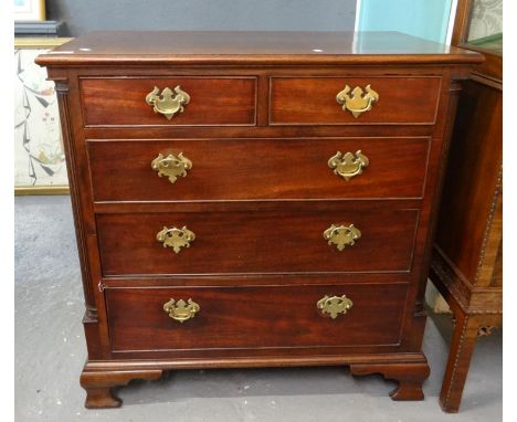 19th century style mahogany straight front chest of two short and three long drawers flanked by reeded pilasters on a project