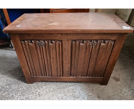 Reproduction oak linen fold panel chest/blanket box.   (B.P. 21% + VAT) 