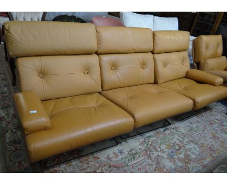 Tetrad retro orange ground leather three seater sofa together with a matching swivel lounge chair on chrome finish bases. 197