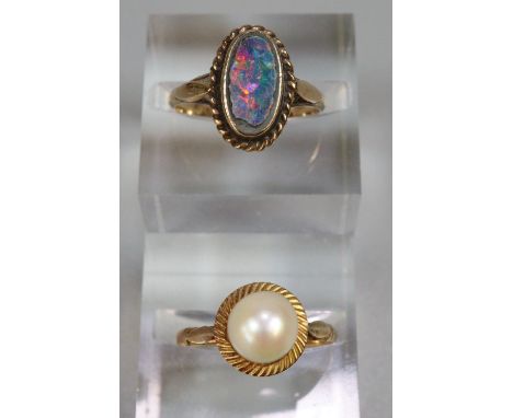 Two yellow metal dress rings, one with opal stone.  3.2g approx.   (B.P. 21% + VAT) 