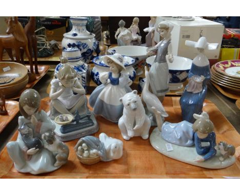 Tray of Lladro and Nao Spanish porcelain figurines to include: nun, girl with geese, polar bear, duck with ducklings, girl wi