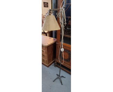 Wrought metal adjustable standard reading lamp with shade.  (B.P. 21% + VAT) 