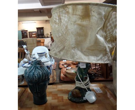 A Guernsey pottery table lamp with hedgehog and tree design with shade and a Guernsey pottery blue glazed ladies head probabl