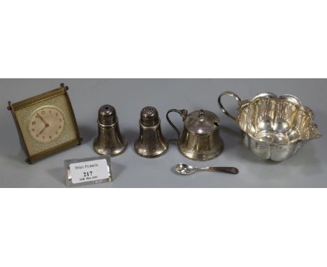 White metal fluted cream jug together with a silver three piece condiment set, EPNS salt spoon and an Ingersoll bedroom/desk 