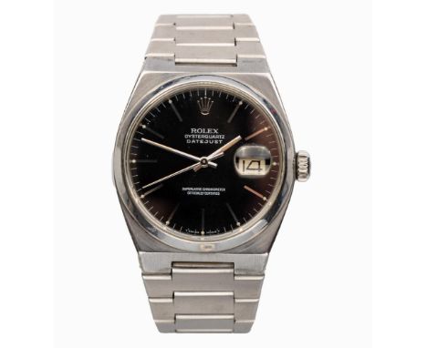 Reference number 1700B, quartz, circular black dial with baton hour markers, calibrated outer ring, centre seconds hand, date