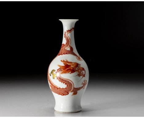 The ovoid body rising to a tall cylindrical neck and flaring mouth, finely painted in iron-red with a sinuous five-claw drago