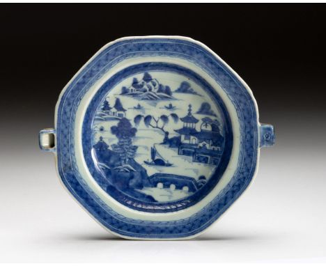 The octagonal plate painted to the centre with a large willow on the banks of a river beside a terraced building with a lone 