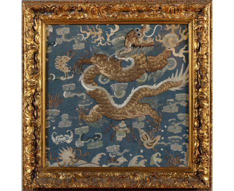 The sinuous five-claw dragon soaring amongst flames and clouds, the mouth wide open exposing the teeth whilst grabbing hold o