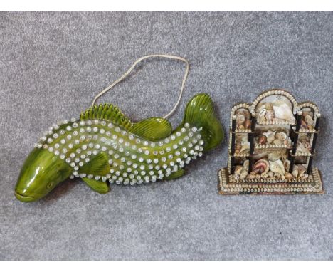 A vintage green glazed ceramic fish light with clear crackle bead scales and a vintage exotic sea shell collage and mirror sc
