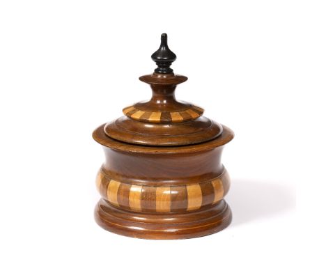 A 19TH CENTURY DUTCH TOBACCO BOX AND COVER with banded alternate light and dark wood turned body, loose inner lid, the cover 
