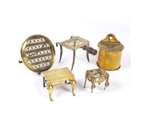 A 19TH CENTURY BRASS AND STEEL TRIVET, with turned wooden handle, 12.5cm high, a pierced brass and iron folding easel stand, 