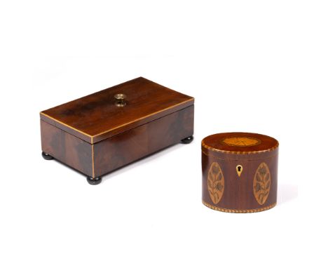 A 19TH CENTURY MAHOGANY AND INLAID OVAL TEA CADDY with chequer strung edges, inlaid with oval paterae and floral motifs, 12cm