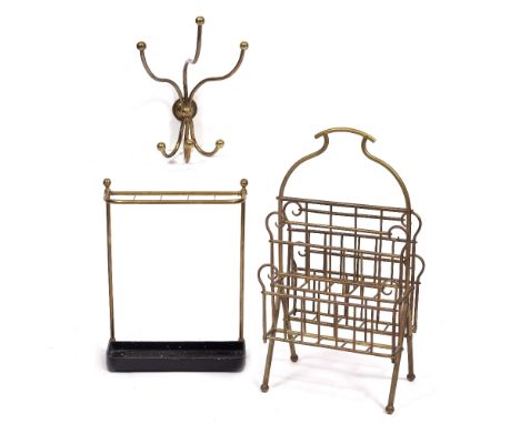 A BRASS TWO TIER MAGAZINE STAND with shaped central handle 40.5cm wide, together with a large brass triple coat hook, 48cm, a