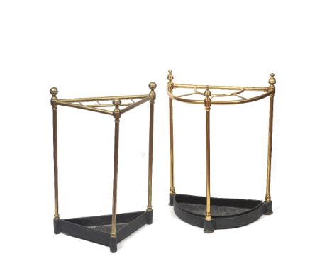 A LATE VICTORIAN BRASS CORNER STICK STAND another similar of half round form 41.5cm and 46cm, both with black painted metal d