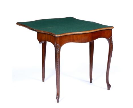 A LATE 18TH CENTURY MAHOGANY CARD TABLE in the French Hepplewhite taste, of serpentine outline with foliate carved slender ca