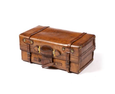 A LATE 19TH CENTURY / EARLY 20TH CENTURY LEATHER TRAVELLING TRUNK the interior with divider and stationery wallet, the outer 