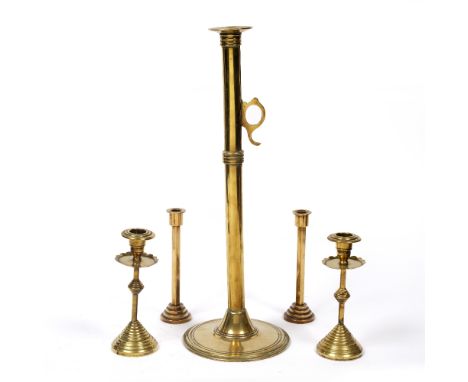 A 19TH CENTURY BRASS EJECTOR CANDLESTICK, with tall column on reeded circular base, 46cm high, a pair of Victorian brass cand