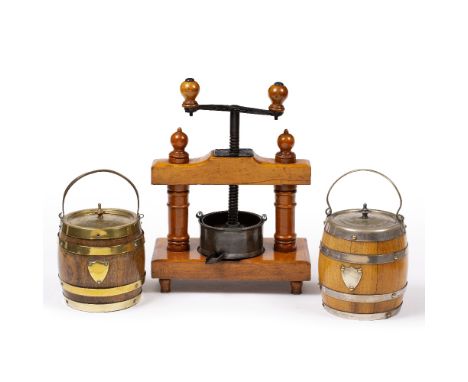 AN ANTIQUE BEECH COFFEE GRINDER with turned supports and twin handled screw mechanism, 37m high, and two oak biscuit barrels,