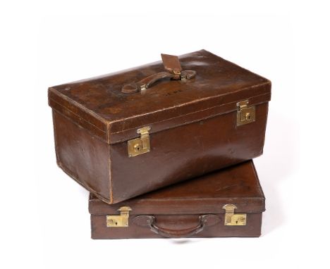 AN EARLY 20TH CENTURY LEATHER TRUNK BY DREW &amp; SONS, with divided interior, top handle, brass locks, the lid stamped 'Sewe