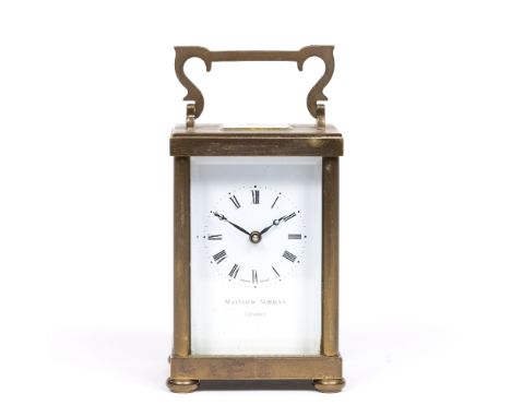 A BRASS CARRIAGE TIMEPIECE by Matthew Norman, London with white enamel Roman dial, 11cm high