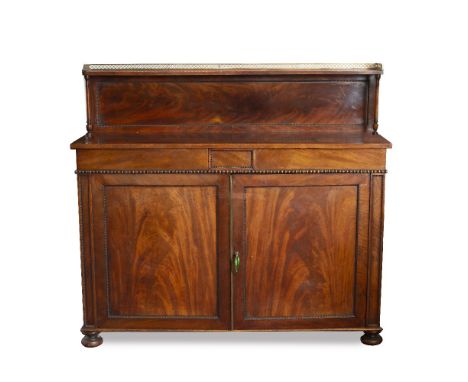 A GEORGE IV MAHOGANY CHIFFONIER having raised back with shelf, above two beaded drawers and a pair of panelled cupboard doors