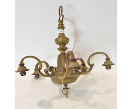 A brass five branch ceiling light