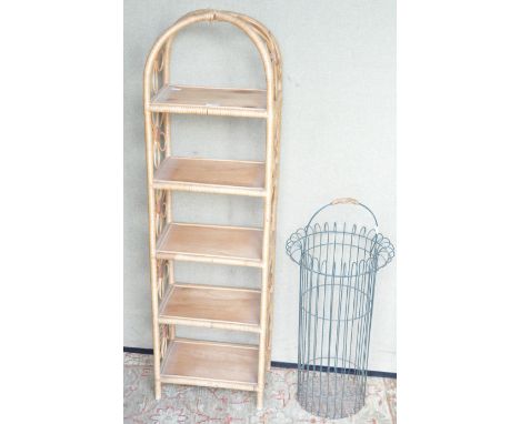 A set of wicker shelves and a stick stand