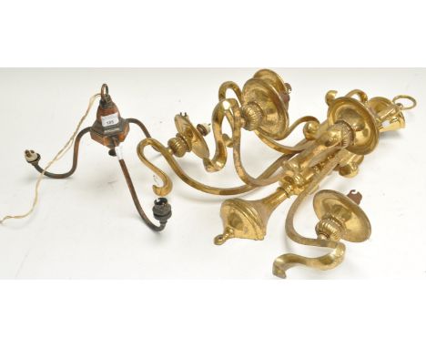 A brass wall light and a three branch ceiling light