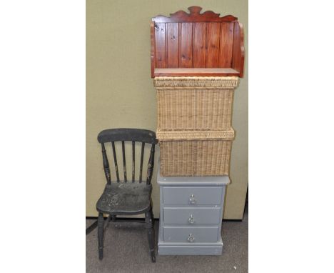 Two baskets, a chair, a wall shelf and a chest