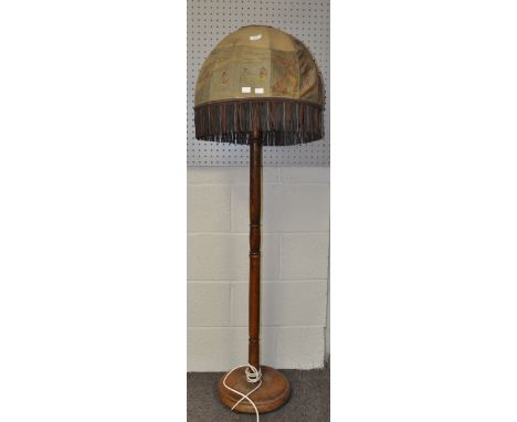 A 1920's wooden standard lamp with oriental shade