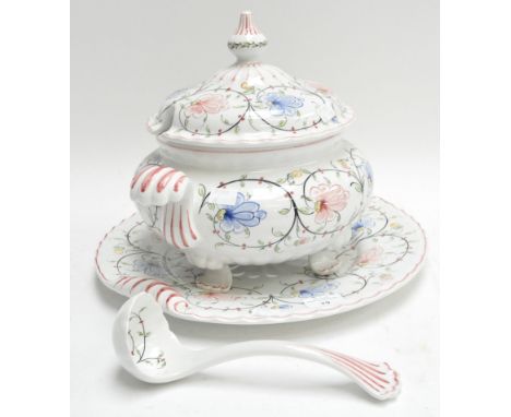 A faience soup tureen, cover, ladle and stand
