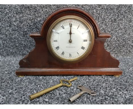 A mahogany cased mantle clock by Reid &amp; Sons, roman enamel dial (chipped), with keys.