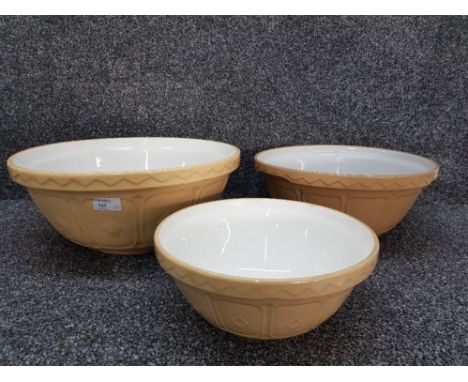Three ceramic mixing bowls of various sizes.