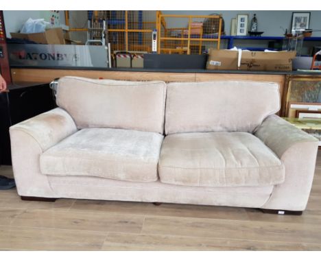 A large two seater sofa and large matching armchair.