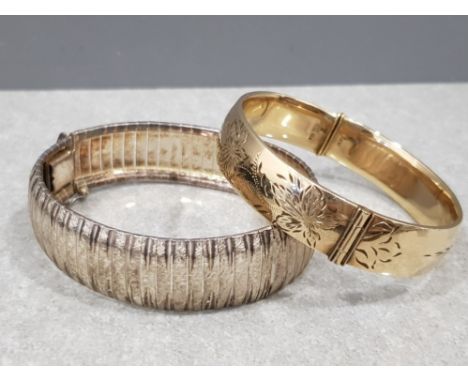 2× bangles including rolled 9ct gold floral bangle and sterling silver bangle, 48.6g total