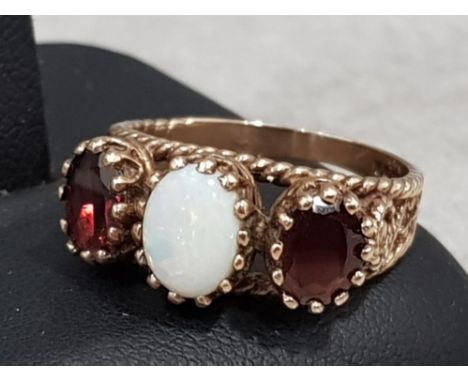 9ct yellow gold garnet and opal ring, 4.3g gross, size O½