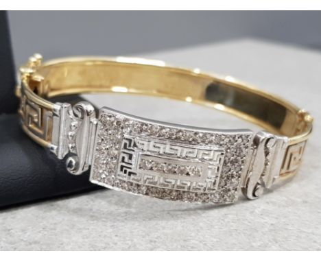 Ladies 14ct yellow gold art deco style bangle, with 38 round brilliant cut diamonds set in white gold, complete with figure 8