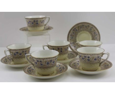 A SET OF SIX ROYAL WORCESTER PORCELAIN COFFEE CUPS &amp; SAUCERS, "Lady Evelyn" pattern, enamelled primrose yellow ground 