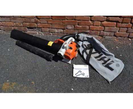 A STIHL GARDEN BLOWER / VAC model SH56C, with instruction manual 