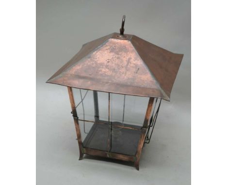A FIRST QUARTER 20TH CENTURY COPPER FRAMED HANGING LANTERN, with plain glazed panel sides, 42cm high (excluding hanging ring)